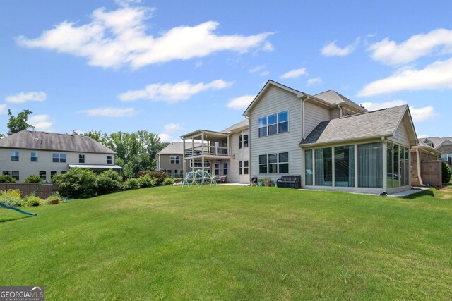 745 Newfield Ln, Alpharetta, GA 30004 - back of house featuring a sunroom and a shingled roof
