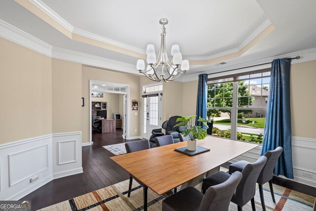 745 Newfield Ln, Alpharetta, GA 30004 - dining room with a raised ceiling, a chandelier, crown molding, wainscoting, and wood-type flooring