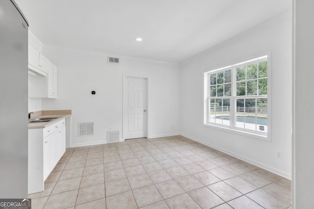 8965 Creekstone Pl, Gainesville, GA 30506 - kitchen with light countertops, light tile patterned floors, a sink, white cabinets, and recessed lighting