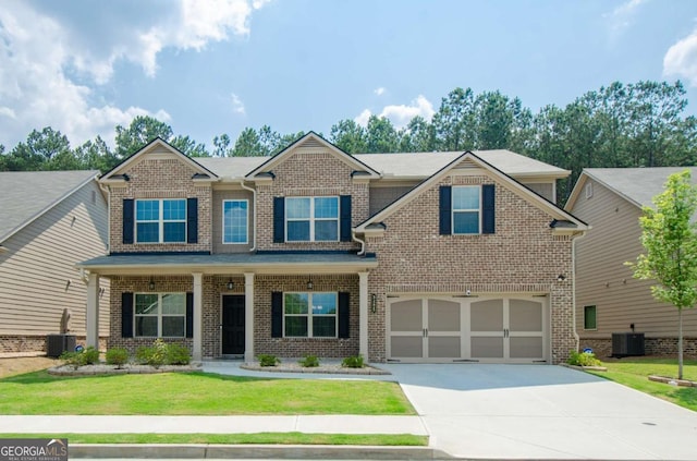 3405 Linstead Ct, Loganville, GA 30052 - craftsman inspired home with concrete driveway, an attached garage, brick siding, central AC, and a front yard
