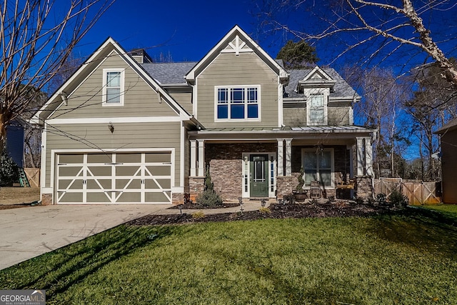 95 Jeffco Dr, Jefferson, GA 30549 - craftsman-style house featuring a standing seam roof, driveway, covered porch, a garage, and a metal roof