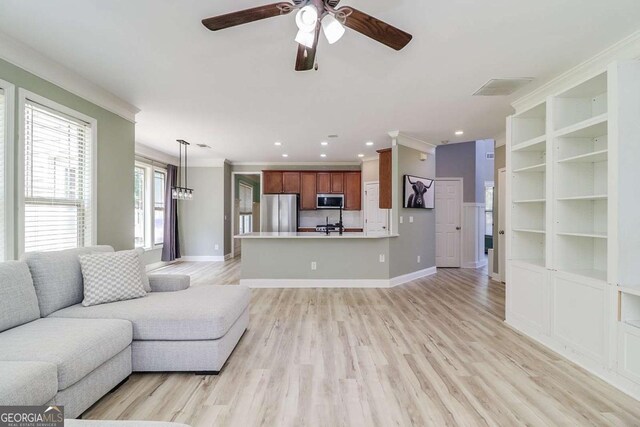 95 Jeffco Dr, Jefferson, GA 30549 - living area featuring crown molding, ceiling fan, light wood-style flooring, and recessed lighting