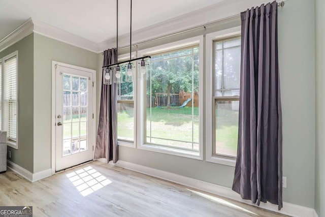95 Jeffco Dr, Jefferson, GA 30549 - unfurnished dining area featuring ornamental molding, wood finished floors, and healthy amount of natural light