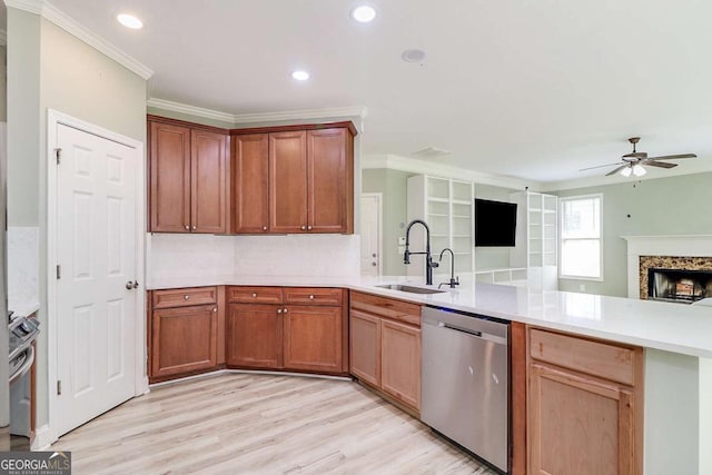 95 Jeffco Dr, Jefferson, GA 30549 - kitchen featuring stainless steel dishwasher, open floor plan, a peninsula, a ceiling fan, and crown molding
