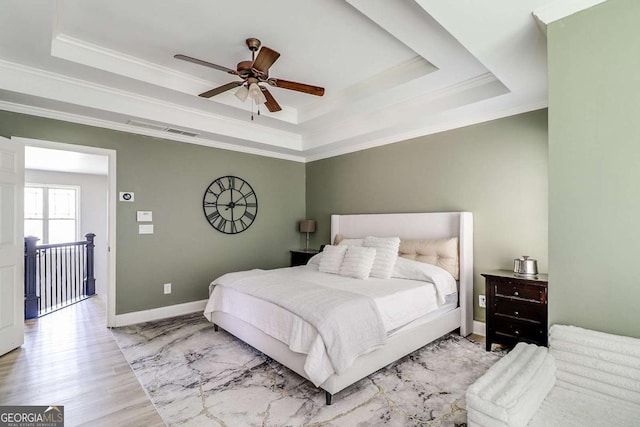 95 Jeffco Dr, Jefferson, GA 30549 - bedroom featuring a tray ceiling, ornamental molding, wood finished floors, and a ceiling fan