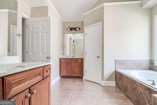 95 Jeffco Dr, Jefferson, GA 30549 - bathroom featuring a garden tub, two vanities, and tile patterned flooring