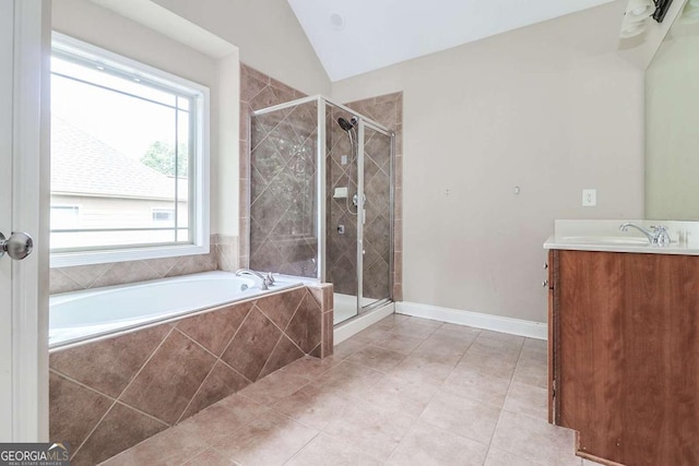 95 Jeffco Dr, Jefferson, GA 30549 - full bathroom featuring a bath, a stall shower, vanity, tile patterned floors, and vaulted ceiling