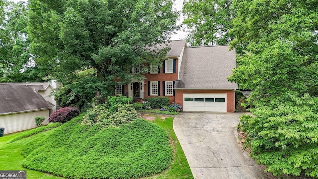 4313 Deep Springs Ct NW, Kennesaw, GA 30144 - colonial inspired home with brick siding, concrete driveway, a shingled roof, and an attached garage