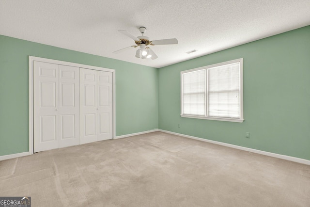 4313 Deep Springs Ct NW, Kennesaw, GA 30144 - unfurnished bedroom featuring a closet, carpet floors, a ceiling fan, and a textured ceiling