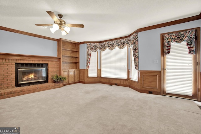 4313 Deep Springs Ct NW, Kennesaw, GA 30144 - unfurnished living room with ornamental molding, ceiling fan, a brick fireplace, wainscoting, and built in features