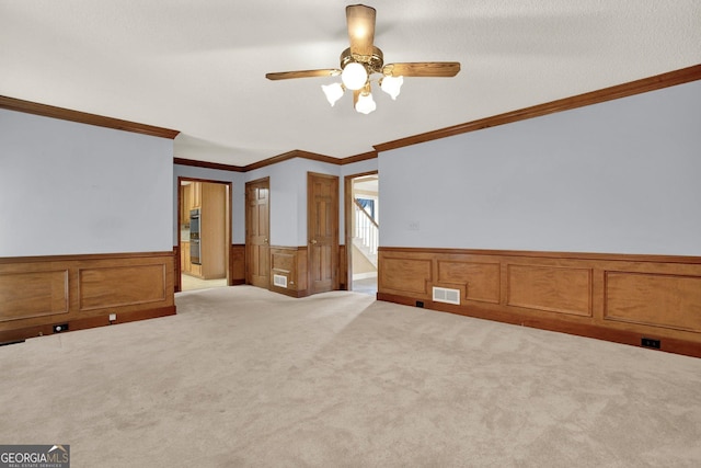4313 Deep Springs Ct NW, Kennesaw, GA 30144 - carpeted spare room featuring a wainscoted wall, crown molding, and a ceiling fan