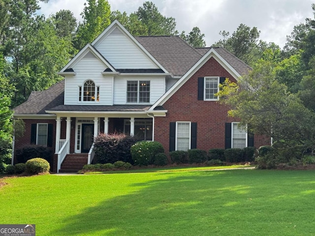 1031 Spring Lake Dr, Bishop, GA 30621 - view of front of home featuring a front yard, brick siding, and a porch