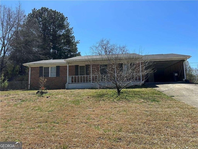 726 Shoreline Trl SE, Conyers, GA 30094 - single story home with concrete driveway, a front lawn, a carport, brick siding, and covered porch