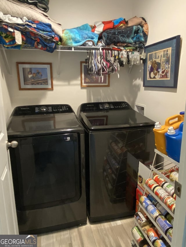 1667 Richard Moore Rd, Dublin, GA 31021 - laundry area with washer and dryer and light wood-style flooring