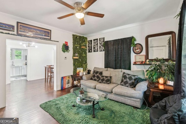 1192 Arlington Ave SW, Atlanta, GA 30310 - living room featuring crown molding, a ceiling fan, a chandelier, and wood finished floors