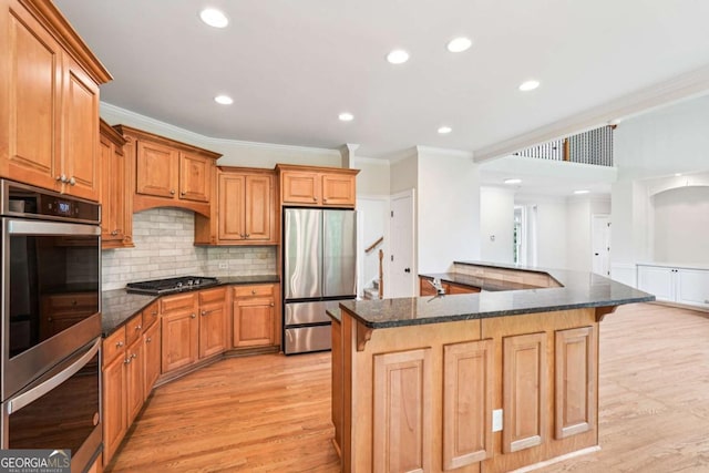4508 Meadow Vista Trce, Lithonia, GA 30038 - kitchen with appliances with stainless steel finishes, crown molding, a breakfast bar, light wood-style floors, and recessed lighting