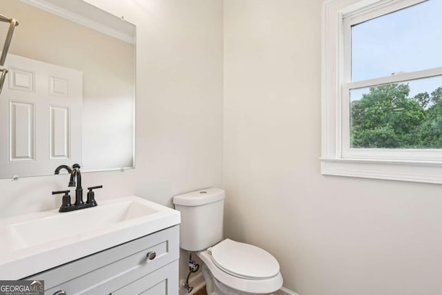4508 Meadow Vista Trce, Lithonia, GA 30038 - half bathroom featuring toilet, vanity, and baseboards