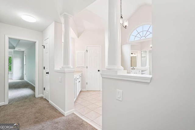 4508 Meadow Vista Trce, Lithonia, GA 30038 - corridor with ornate columns, light carpet, and lofted ceiling
