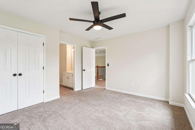 4508 Meadow Vista Trce, Lithonia, GA 30038 - unfurnished bedroom with light carpet, a closet, ensuite bath, and a ceiling fan