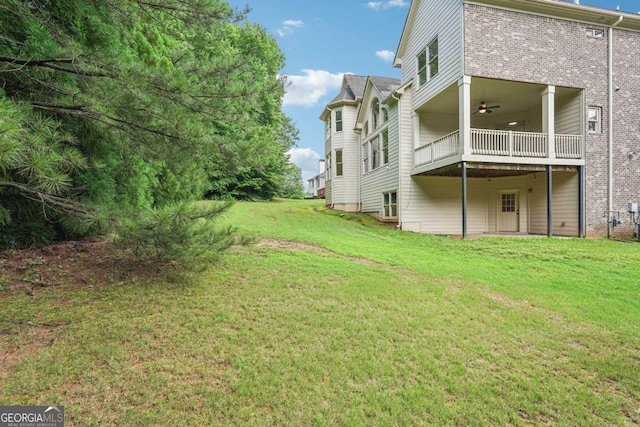 4508 Meadow Vista Trce, Lithonia, GA 30038 - view of grassy yard featuring a ceiling fan and a balcony