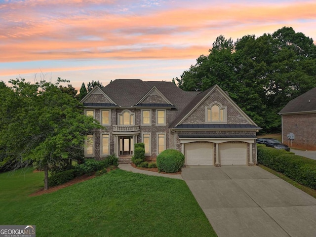 4508 Meadow Vista Trce, Lithonia, GA 30038 - view of front facade with driveway, a front lawn, brick siding, and a garage