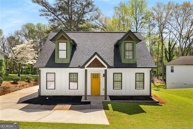 1071 N Price Rd, Sugar Hill, GA 30518 - view of front of house with board and batten siding, a front yard, and a shingled roof