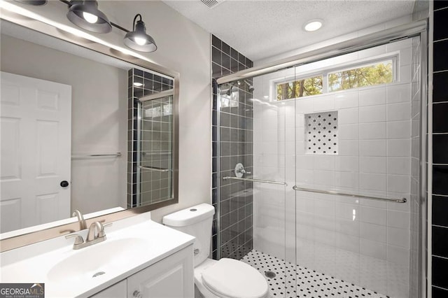 1071 N Price Rd, Sugar Hill, GA 30518 - full bath featuring a stall shower, vanity, and a textured ceiling