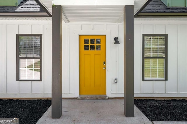 1071 N Price Rd, Sugar Hill, GA 30518 - doorway to property featuring board and batten siding and a shingled roof