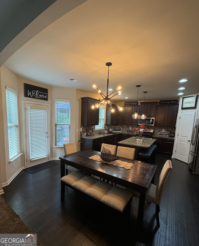 124 Gorham Gates Ct, Hiram, GA 30141 - dining space with a chandelier, dark wood-type flooring, and recessed lighting