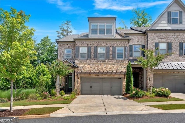 1099 Heyward Way, Alpharetta, GA 30009 - view of front of house with an attached garage, concrete driveway, brick siding, and stone siding