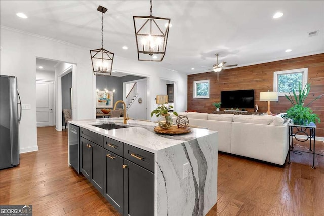 1099 Heyward Way, Alpharetta, GA 30009 - kitchen featuring stainless steel appliances, a ceiling fan, wood finished floors, a kitchen island with sink, and recessed lighting