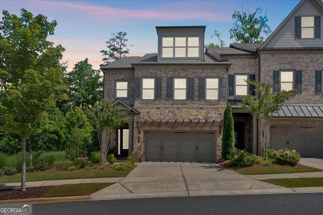 1099 Heyward Way, Alpharetta, GA 30009 - view of front of home with a garage, concrete driveway, stone siding, and brick siding
