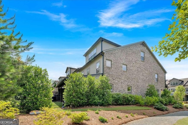 1099 Heyward Way, Alpharetta, GA 30009 - view of side of home featuring brick siding