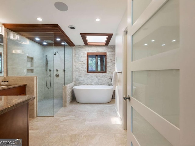 178 Rowland Pt, Morganton, GA 30560 - bathroom with vanity, a walk in shower, a freestanding tub, a skylight, and recessed lighting