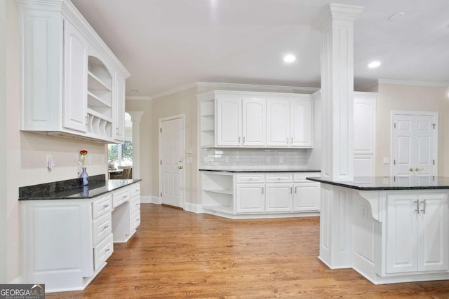 3741 Cape York Trce, Alpharetta, GA 30022 - kitchen with open shelves, ornamental molding, white cabinets, backsplash, and light wood finished floors