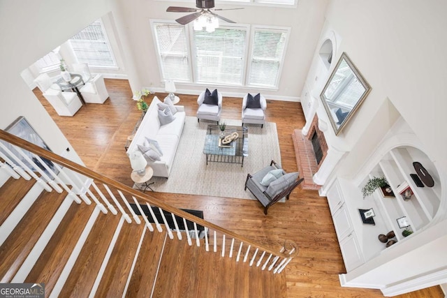 3741 Cape York Trce, Alpharetta, GA 30022 - living room with ceiling fan, wood finished floors, a high ceiling, and built in features