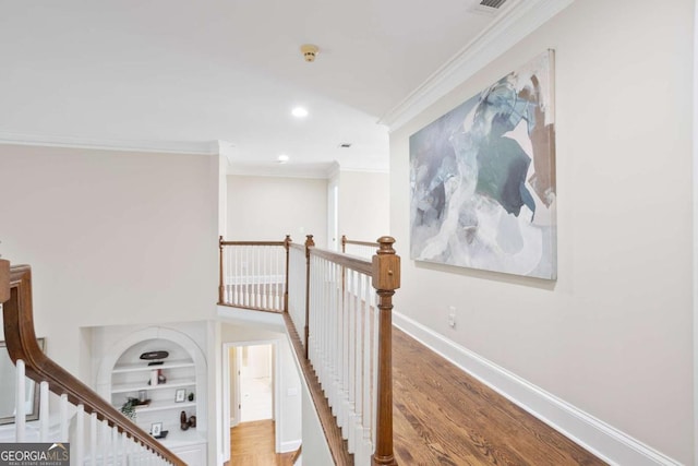 3741 Cape York Trce, Alpharetta, GA 30022 - hall featuring ornamental molding, recessed lighting, built in shelves, wood finished floors, and an upstairs landing