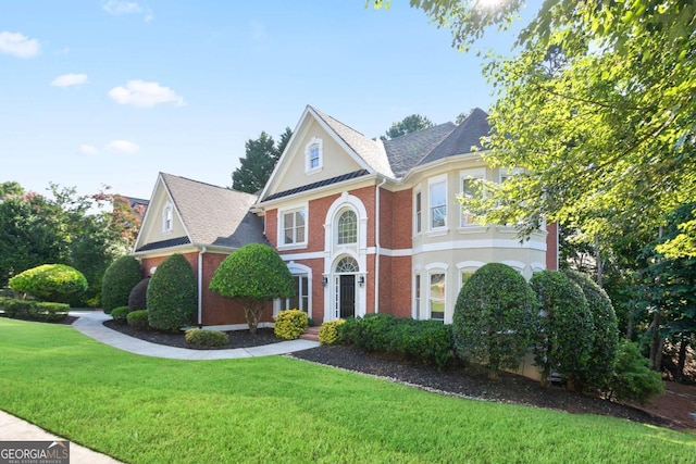 3741 Cape York Trce, Alpharetta, GA 30022 - view of front of property featuring a front lawn, brick siding, stucco siding, and roof with shingles