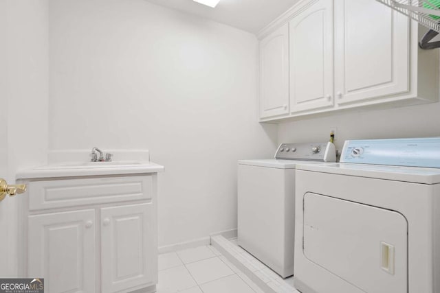 3741 Cape York Trce, Alpharetta, GA 30022 - laundry room featuring washer and dryer, cabinet space, and light tile patterned floors