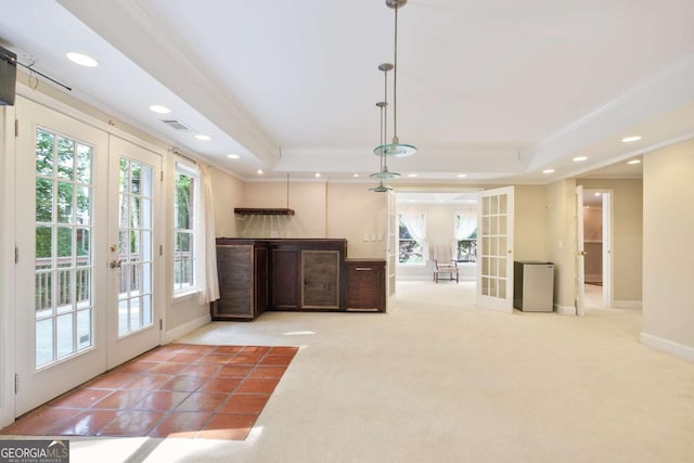 3741 Cape York Trce, Alpharetta, GA 30022 - unfurnished living room featuring french doors, crown molding, a raised ceiling, plenty of natural light, and recessed lighting