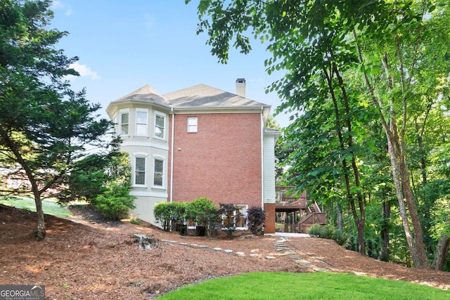 3741 Cape York Trce, Alpharetta, GA 30022 - view of side of home featuring a chimney and brick siding