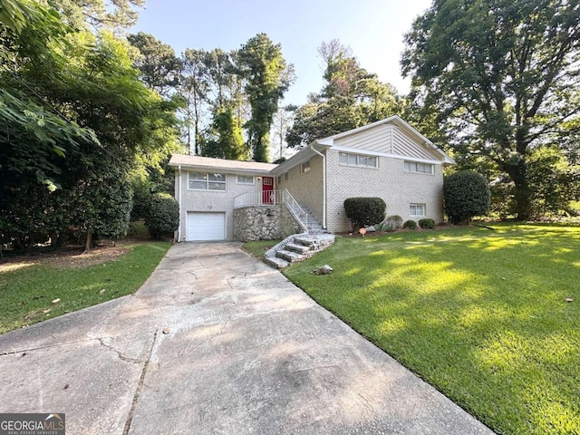 3456 Spring Cir, Decatur, GA 30032 - tri-level home featuring driveway, a front yard, a garage, and brick siding