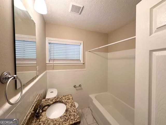 3456 Spring Cir, Decatur, GA 30032 - full bath featuring toilet, shower / bath combination, a textured ceiling, and vanity