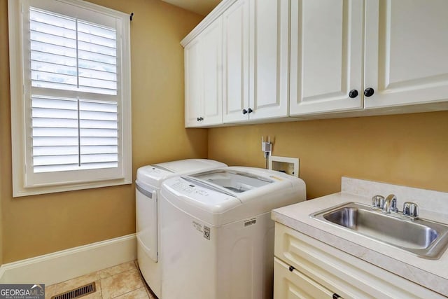 116 Archstone Sq, Mcdonough, GA 30253 - washroom with independent washer and dryer, cabinet space, and light tile patterned floors