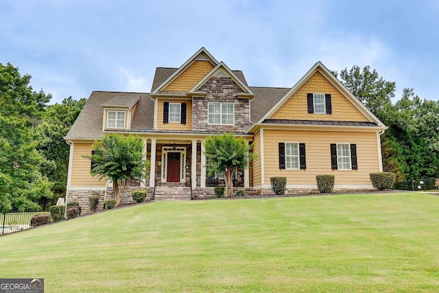 116 Archstone Sq, Mcdonough, GA 30253 - craftsman inspired home featuring a standing seam roof, stone siding, a metal roof, and covered porch
