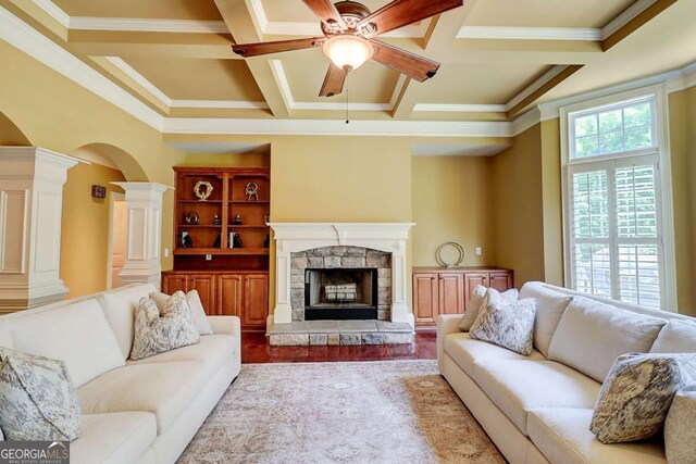 116 Archstone Sq, Mcdonough, GA 30253 - living area featuring decorative columns, a ceiling fan, crown molding, wood finished floors, and a fireplace