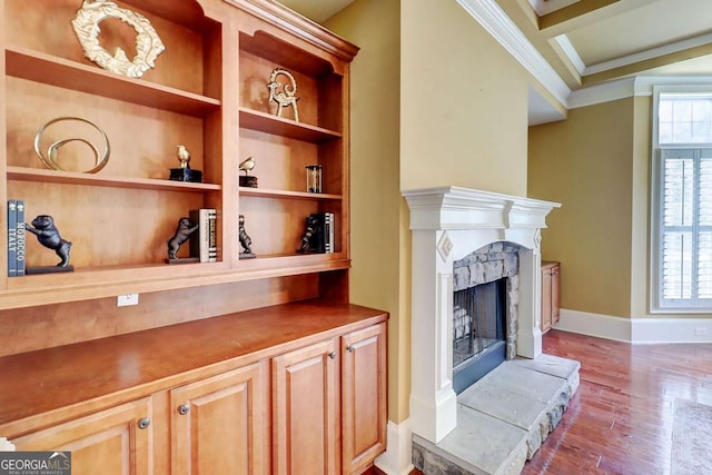 116 Archstone Sq, Mcdonough, GA 30253 - detailed view of a high end fireplace, ornamental molding, wood finished floors, and built in shelves