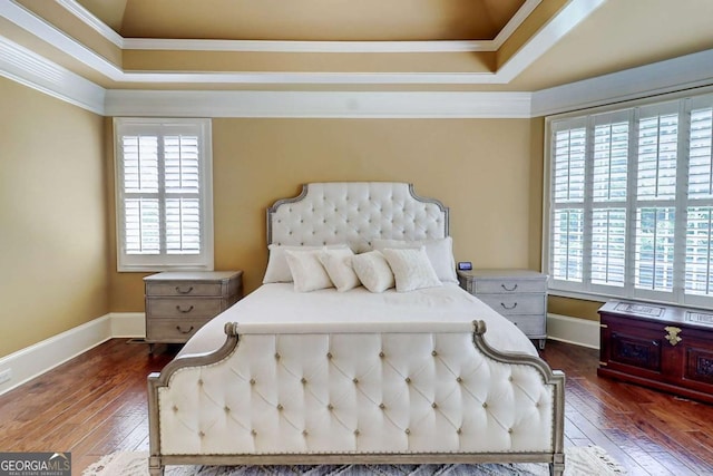 116 Archstone Sq, Mcdonough, GA 30253 - bedroom with a tray ceiling, multiple windows, crown molding, and dark wood-style flooring