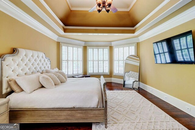 116 Archstone Sq, Mcdonough, GA 30253 - bedroom featuring dark wood-type flooring, crown molding, and a raised ceiling