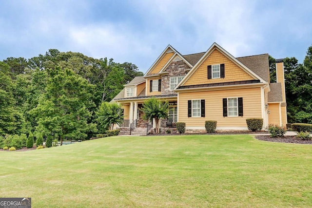 116 Archstone Sq, Mcdonough, GA 30253 - craftsman-style house with a standing seam roof, a front yard, a metal roof, and a porch